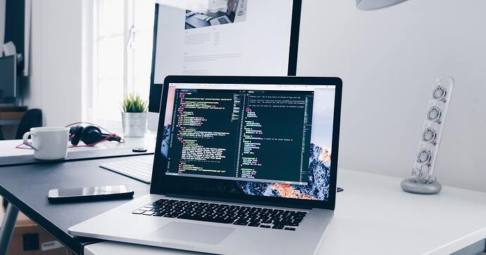 developer laptop code editor desk